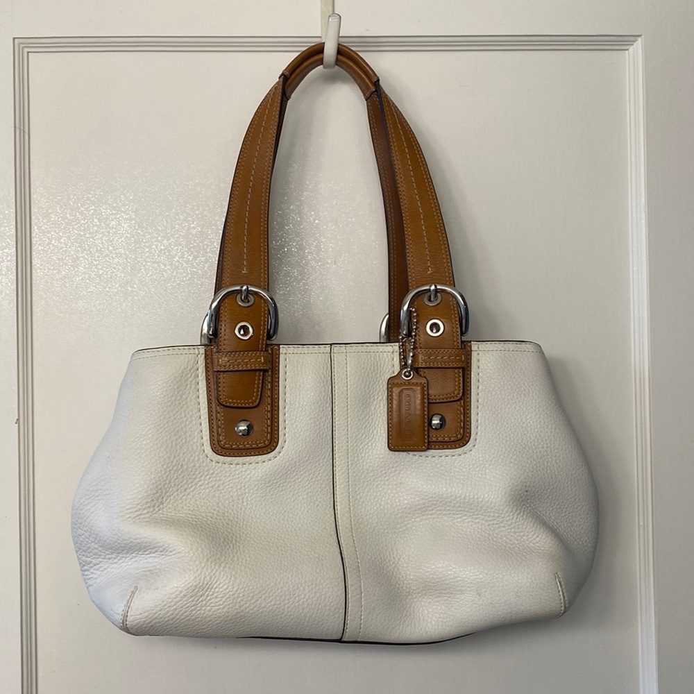 Coach leather purse. White with tan buckle straps